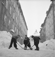La Chaux-de-Fonds, men shoveling snow; 1952.