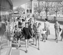 Dietikon; boys carrying schoolbag after school; 1955.