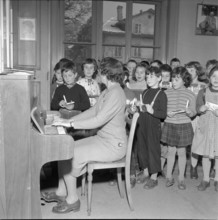 Teacher at the piano with class, Zurich 1956.