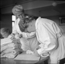 Women during World War 2; women sewing; 1939.
