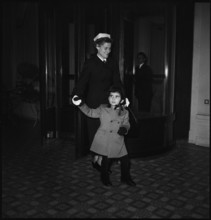 Prince Hassan of Jordan with his nurse, Lausanne 1952.