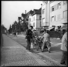 War fire brigade: men with hose cart, 1939.