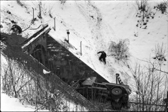 Truck lying on rails in front of tunnel entrance 1969.