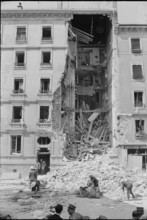 Fire brigade in action at apartment house after explosion, Geneva 1965.