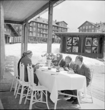 Tourists at Kleine Scheidegg; men drinking coffee; 1957