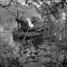 Reconnaissance squad in rubber dinghy, recruit training 1965