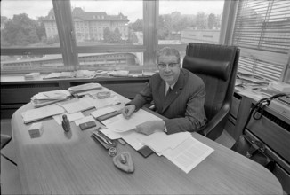 SDA managing director Georges Duplain in his office, 1971