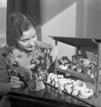 Woman making a market stall for children, 1941