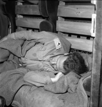Sleeping soldier of British Army on train back home 1945
