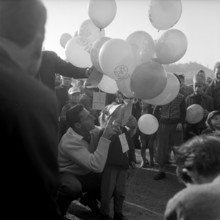 Children letting balloons fly, with self-addressed cards; Zurich 1957