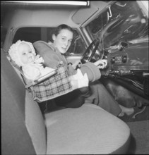 21st Geneva International Motor Show, 1951: woman at steering wheel