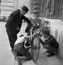 Basel, boys offer cleaning of bicycles; 1941