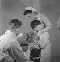 Boy at diphteria vaccination, children's clinic Zurich around 1947