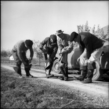 Electric fishing in Valais, rubber boots for isolation, 1956