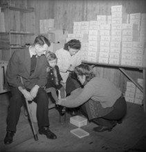 Disabled child getting new shoes, 1945