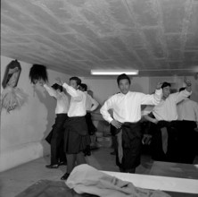Tibetan men practicing folk dance, Waldstatt 1963