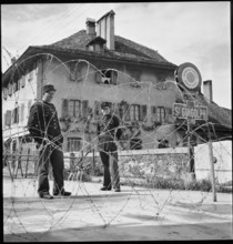 WW 2: French border guards behind barbwire barrage, St. Gingolph around 1943