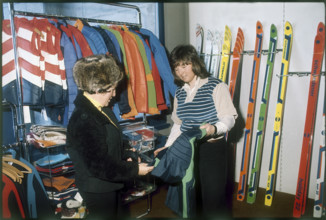 Marie-Theres Nadig in sports articles shop, 1975