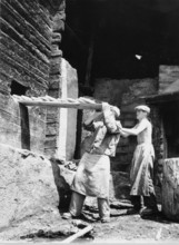 Baking bread in mountain village in Valais, historical