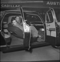 Visitors test the comfort of the interior trim