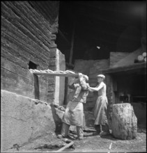 Men baking bread in St. Luc, Valais, in 1941