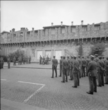 Army chaplains practicing laying of a wreath, castle yard Bellinzona 1962