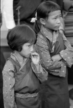 Two Tibetan girls in traditional costume, Oetwil 1965
