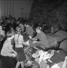 Volunteers sorting clothing for emergency aid in Hungary, Berne 1956