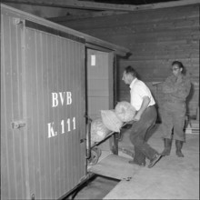 Workers loading sacks in the Bex salt mine; 1959