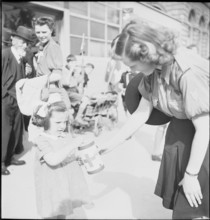 May 8th. 1945, Armistice's day: Woman collects money for the Swiss donation