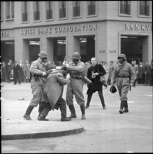 Policemen bashing demonstrator; 1961