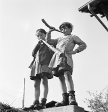 Boy playing the horn on the day of Feuillu, 1944