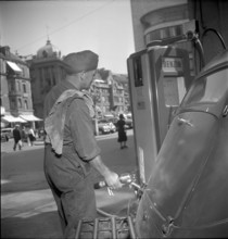 Filling Station Attendant Filling the Fuel Tank, 1950