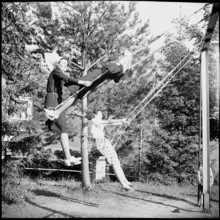 Young nurses swinging in the garden