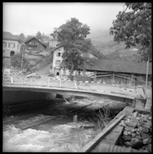 New bridge next to old wooden bridge under construction; 1957