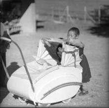 Tibetan child with pram, underwater 1961