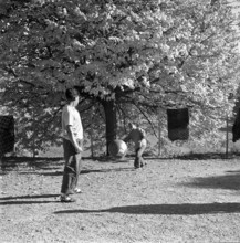 Tibetan playing football, underwater 1961