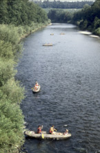Children canoeing on river