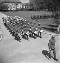 Drummers tabouring; soldiers marching; 1942