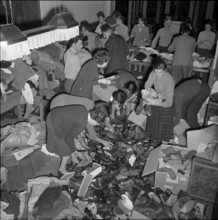 Students sorting clothing for emergency aid in Hungary, Lausanne 1956