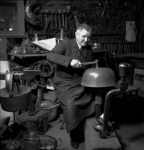 Geneva: artist blacksmith in his studio; 1943