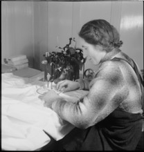 Home embroideress at work, 1942