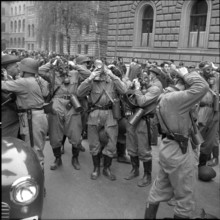 Policemen prepare for action; 1961