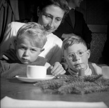 Mother with her children at Christmas, 1952
