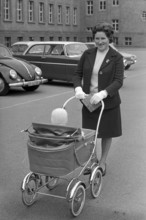 Woman with stroller and voting card 1963