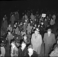 2 grim men in the midst of the Räbeliechtli procession, Zurich 1958