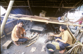 Men cooking on Sawu island, Indonesia, 1986