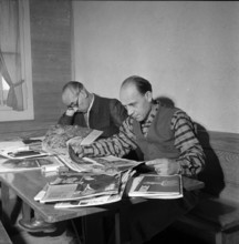 Hungarian refugees reading, Switzerland 1956