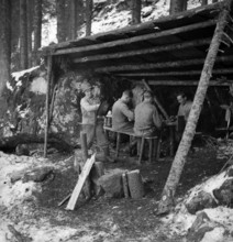 Woodcutter having a break in a refuge, 1943