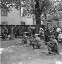 Boys shooting with crossbows, 1941